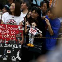 Fans await Paul McCartney\'s arrival at the Nippon Budokan Hall in Tokyo on Wednesday. | REUTERS