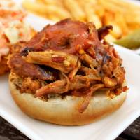 Heap of joy: A pulled-pork sandwich topped with a tasty sauce. | DON KENNEDY