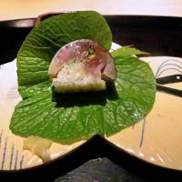 At Gion Nishikawa, a slice of saba bozushi: pressed sushi made with aged, seasoned mackerel from the Japan Sea.  | ROBBIE SWINNERTON