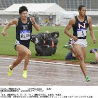 Speed to burn: Yoshihide Kiryu (left) competes against Aska Cambridge in the men\'s 100-meter race at the Oda Memorial International meet on Sunday in Hiroshima. Cambridge won the race in 10.37 seconds and Kiryu finished in 10.40. | KYODO