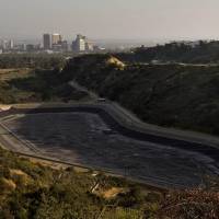 Danger zone: An empty water reservoir sits in the hills above Los Angeles on April 5 as a severe drought continues to affect the state of California. | AFP-JIJI