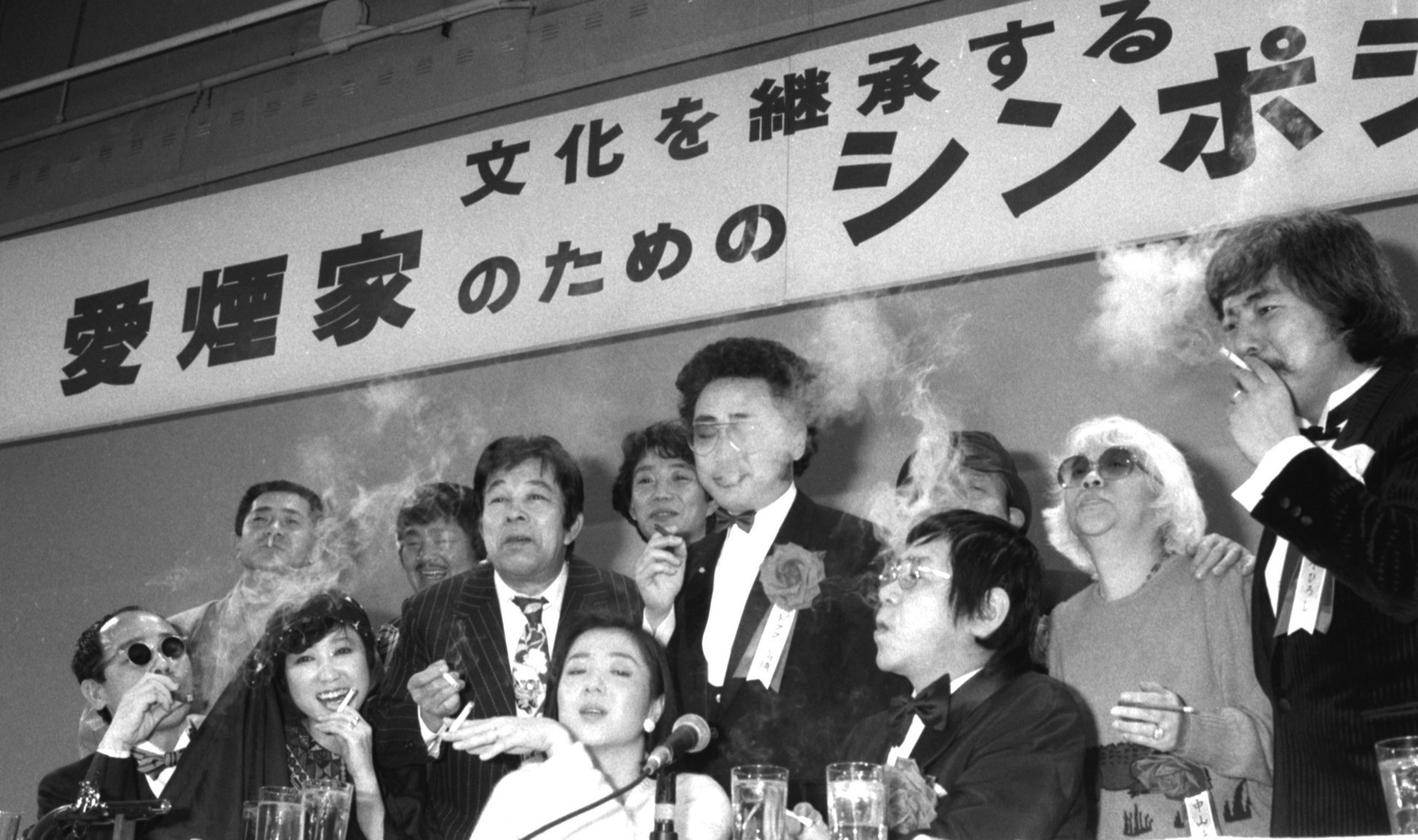 Puff peace: Two hundred smokers, including celebrities, gather to defend smokers' rights at a 'Symposium on Behalf of Heavy Smokers' held at a Tokyo hotel on April 1, 1985, the day that the Japan Tobacco and Salt Public Corp. monopoly became Japan Tobacco Inc. JT is a well-known post-retirement amakudari destination for Finance Ministry bureaucrats. | KYODO