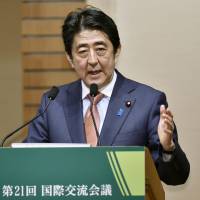 Prime Minister Shinzo Abe delivers a speech at a hotel in Tokyo on Thursday. | KYODO