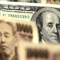 Ten-thousand-yen bank notes and U.S. $100 bills are arranged for a photograph. Despite the yen’s recent resilience against the dollar, it has been dropping against its other major peers at the fastest pace in six months. Yen's stealthy depreciation disguised by resilience versus dollar