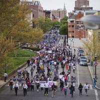 Protesters march Thursday toward City Hall to demonstrate against the police-custody death of Freddie Gray in Baltimore. | AP