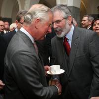 Britain’s Prince Charlesshakes hands with Irish Republican party Sinn Fein leader Gerry Adams at the National University of Ireland in Galway, Ireland, on Tuesday. Prince Charles has historic handshake with Sinn Fein leader Gerry Adams