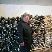 North Korean leader Kim Jong Un visits the Sokmak Atlantic Salmon Breed-fish Ground and Raksan Offshore Salmon Fish Farm in this picture released on May 23. | AFP-JIJI