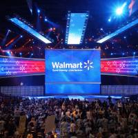 Wal-Mart employees cheer at the Wal-Mart U.S. associates meeting in Fayetteville, Arkansas, on June 4, 2014. Wal-Mart says it only asks salaried employees to give to politicians, and that workers are free to stipulate whether their contributions go to Democratic or Republican candidates. | REUTERS