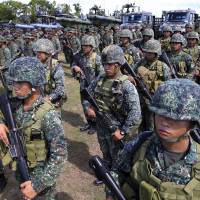 Troops take part in a commemoration of the 117th anniversary of the Philippine Navy at Pascual Ledesma, south of Manila, on Monday. | REUTERS