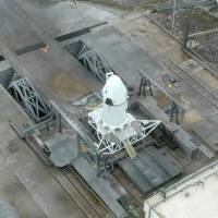 The SpaceX Dragon spaceship on the pad before launch Wednesday during the first test of the Dragon\'s flight abortion sytem at Cape Canaveral, Florida. | NASA TV / HANDOUT /AFP-JIJI
