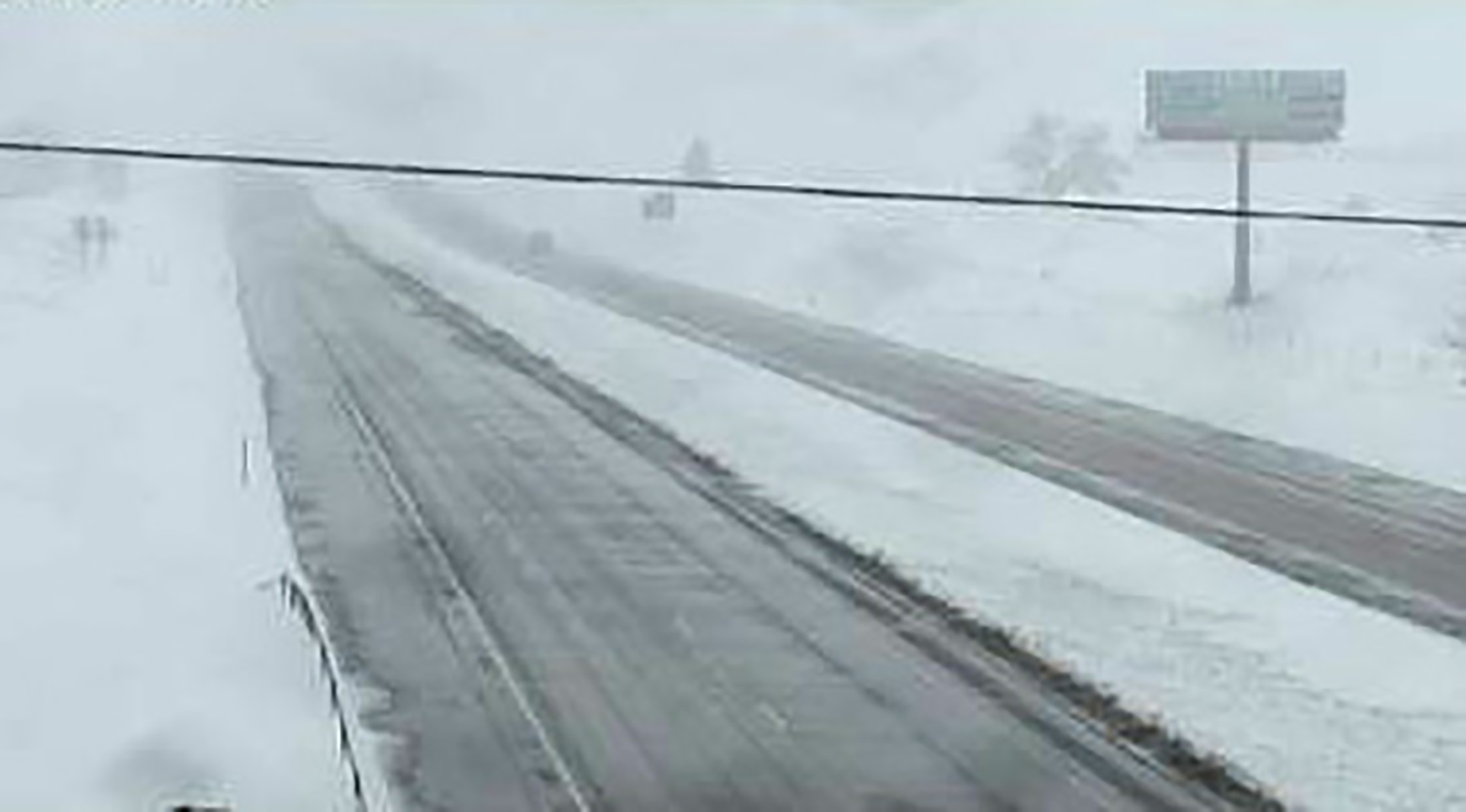 Snow covers the ground off Interstate 90 east of Sturgis, South Dakota, in this view from a highway camera taken Sunday.  Hail, snow, a tornado and a tropical storm made it a 'severe weather' Mother's Day in much of the center of the United States and on the Carolina coast on Sunday. | SOUTH DAKOTA DEPARTMENT OF TRANSPORTATION / HANDOUT  / REUTERS