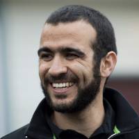 Omar Khadr speaks to the media outside his lawyer\'s home in Edmonton, Alberta, on Thursday. The former Guantanamo Bay prisoner had his first taste of freedom in almost 13 years after an Alberta judge rejected a last-ditch attempt by the federal government to block his release. | AP