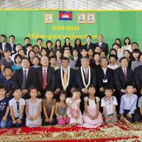 Teachers, pupils and supporters pose for a photo in Phnom Penh on Sunday during the opening ceremony for Cambodia\'s first dedicated school for Japanese children living in the country. | KYODO