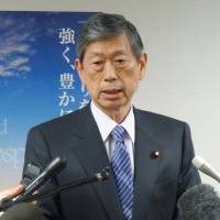 Masahiko Komura speaks to reporters in April 2013. A group of senior Diet members led by Komura, including ruling and opposition party lawmakers, arrived in the Chinese capital on Monday. | KYODO