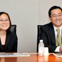 Leslie Ito (left), president of the Japanese American Cultural and Community Center (JACCC), and Chairman George Tanaka speak during a visit to The Japan Times office in Minato Ward, Tokyo, on Wednesday. | YOSHIAKI MIURA