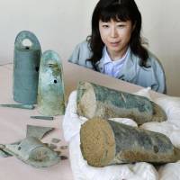Bell-shaped bronze vessels from the Yayoi Period discovered in Minamiawaji, Hyogo Prefecture, last month are displayed Tuesday. | KYODO