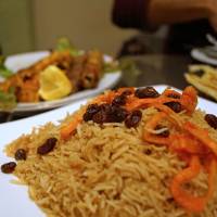 Afghani spice: Rice is topped with juicy raisins and carrots. | ADAM MILLER