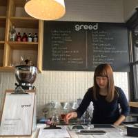 Wages of sin: A worker at Greed prepares coffee at the counter. | ROBBIE SWINNERTON