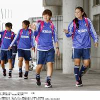 Getting ready for action: Japan\'s Homare Sawa (right) and Aya Miyama wave to fans on Monday. | KYODO