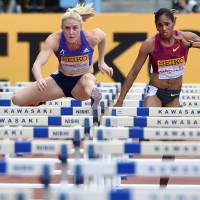 Obstacles to clear: Australia\'s Sally Pearson (left) and American Kristi Castlin compete in the women\'s 100-meter hurdles on Sunday in Kawasaki. Pearson won the event in 10.66 seconds. | AFP-JIJI