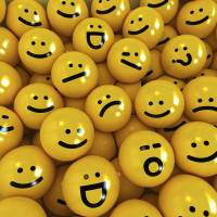 Emoji, a Japanese contraction for emoticons, are rendered on yellow balls. The word is among over 1,700 new entries added to the Merriam-Webster unabridged dictionary. | ISTOCK