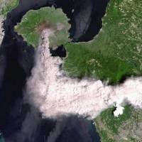 A satellite image shows smoke billowing from Mount Sakurajima in Kagoshima Prefecture on Thursday. The volcanic plume reached an altitude of 4,300 meters, the sixth-highest on record, as authorities issued ash and falling rock alerts in the surrounding areas. | REMOTE SENSING TECHNOLOGY CENTER OF JAPAN / KYODO