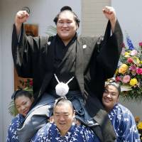 Terunofuji is held aloft by members of his stable after being promoted to sumo\'s second-highest rank of ozeki on Wednesday. | KYODO