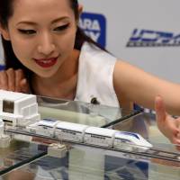 Toymaker Takara Tomy\'s new \"LinearLiner\" maglev train toy is shown to media in Tokyo\'s Ginza shopping district Tuesday. The toy, which uses electromagnets to move along its tracks, will go on sale in September at a price of &#165;35,000. | SATOKO KAWASAKI
