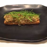For one of his stellar starters, Meguro pairs foie gras with kegani crab meat, seasons it with konatsu citrus, piles it all onto a base of flaky pastry and garnishes it liberally with chives. | ROBBIE SWINNERTON
