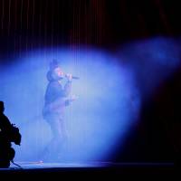 The Weeknd performs at the Apple Worldwide Developers Conference in San Francisco on Monday. The maker of iPods and iPhones announced Apple Music, an app that combines a 24-hour, seven-day live radio station called \"Beats 1\" with an on-demand music streaming service. | AP