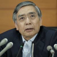 Bank of Japan Gov. Haruhiko Kuroda speaks during a news conference at the central bank\'s headquarters in Tokyo on June 19. | BLOOMBERG