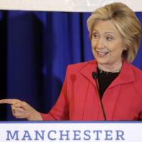Democratic presidential candidate Hillary Rodham Clinton addresses an audience during a campaign stop at a Flag Day dinner Monday in Manchester, New Hampshire. | AP