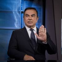 Nissan Motor Co. President Carlos Ghosn, Japan\'s best-paid automaker executive, is interviewed in New York on June 3. He received more than &#165;1 billion in salary and bonuses for the year that ended March 31, it was announced Tuesday. | BLOOMBERG