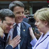 Greek Prime Minister Alexis Tsipras (left), Italian Prime Minister Matteo Renzi (center) and German Chancellor Angela Merkel attend a European Union leaders summit in Brussels on Saturday. | REUTERS