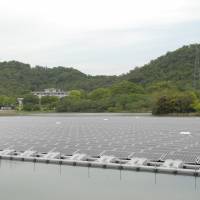 Kyocera\'s \"mega-solar\" station, on floating on the surface of a reservoir in nearby Hyogo Prefecture, uses 9,072 waterproof solar panels. | KYOCERA