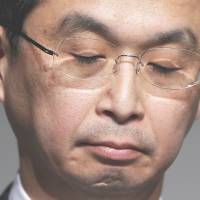 Takata Corp. President Shigehisa Takada makes a rare appearance at a news conference in Tokyo on Thursday as the parts maker gave a briefing on its massive recalls of defective air bags that have led to the deaths of eight people. | REUTERS