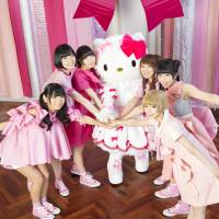 Tie a pink ribbon: Idol group Dempagumi.inc join forces with the iconic Hello Kitty in a new music video. | &copy; 1976, 2015 SANRIO CO., LTD.