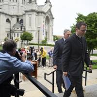 Auxiliary Bishop Andrew Cozzens (right) and Tom Halden, director of communications for the Archdiocese of Saint Paul U.S. archdiocese indicted over sex-abuse coverup; archbishop quits; Vatican charges envoy