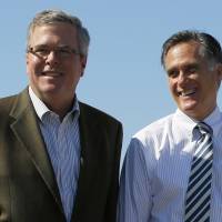 Republican presidential nominee Mitt Romney and former Florida Governor Jeb Bush (left) pose for a photograph together after a 2012 Romney for President campaign rally in Tampa, Florida, in this October 31, 2012, file photo. In 2012, having failed to define himself otherwise, Romney left himself open to attack from rivals in both parties. Democrats called him an out-of-touch wealthy elitist. Conservatives were skeptical of him. Bush looks set to declare his Republican candidacy for president Monday. | REUTERS