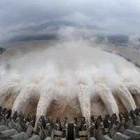 Water is released from the Three Gorges Dam in Yichang, on the Yangtze River in central China\'s Hubei province. | XINHUA/AP