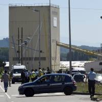 French security and emergency services gather at the entrance of the Air Products company in Saint-Quentin-Fallavier, near Lyon, central eastern France, o Friday. An attacker carrying an Islamist flag killed one person and injured several others at a gas factory in eastern France, according to a legal source. | AFP-JIJI