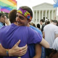 Gay rights supporters celebrate Friday after the U.S. Supreme Court ruled that the U.S. Constitution provides same-sex couples the right to marry, outside the Supreme Court building in Washington, D.C. | REUTERS