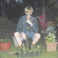 Posted to a website with a racist manifesto, this photo appears to show Dylann Roof posing with a Confederate flag and a gun in April. Roof is the suspect in the June 17 church massacre in Charleston, South Carolina. | REUTERS