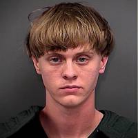 This booking photo shows Dylann Roof after his arrest Thursday on suspicion of fatally shooting nine people at a historic black church in Charleston, South Carolina. A Facebook profile apparently belonging to Roof contained only one public photograph of him, wearing a black jacket featuring the flags of apartheid-era South Africa and white-ruled Rhodesia, which now is Zimbabwe. | REUTERS