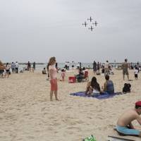 In this May 2014 file photo, Israelis watch an air show during Independence Day in Tel Aviv. The world’s Jewish population has grown to be nearly as large as it was before the Holocaust, an Israeli think tank said in its annual report Sunday. Jewish population worldwide near pre-Holocaust level, report says