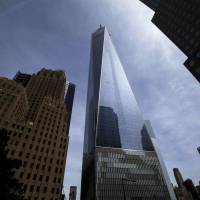 The One World Trade Center Tower is seen from West Street in New York on May 20. Three men who jumped with parachutes from the top of One World Trade Center were convicted of criminal charges on Monday in their plunge from America\'s tallest building. Their leap from the top of the 104-story building was partly caught on security video that showed at least two figures in black suits and helmets floating down beneath open parachutes and landing on the streets of Lower Manhattan, one of their defense attorneys said. | REUTERS