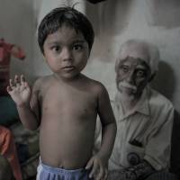 These ethnic Rohingya from Myanmar now live with other refugees in a house in the suburbs of Kuala Lumpur. | AFP-JIJI