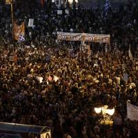 Protesters gather during an anti-austerity demonstration in support of the Greek government in Syntagma Square in Athens on Monday. European leaders intervened in Greece\'s referendum campaign by framing Sunday\'s vote as an up-or-down decision on whether to quit the euro and the wider European Union. | BLOOMBERG