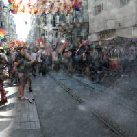 Turkish riot police use water cannon to disperse people taking part in the Gay Pride parade Sunday in Istanbul. Police took the action against the crowd when demonstrators began shouting slogans accusing the social conservative President Recep Tayyip Erdogan of \"fascism.\" | AFP-JIJI
