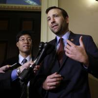 Democratic state Sen. Ben Allen gestures as Sen. Richard Pan looks on Monday before reporters after their measure requiring nearly all California schoolchildren to be vaccinated was approved by the state Senate in Sacramento. The bill will go to the governor. | AP
